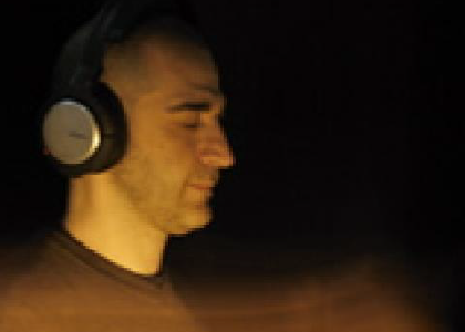 a person wearing headphones with their eyes closed