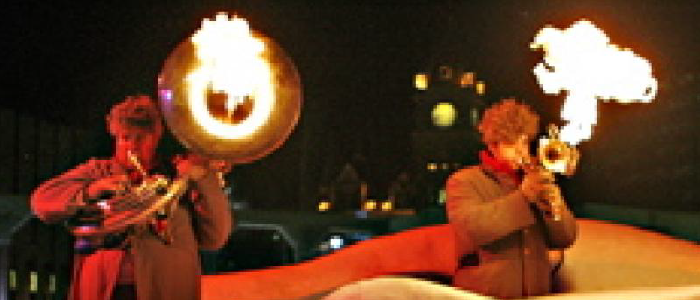 two musicians with flaming instruments