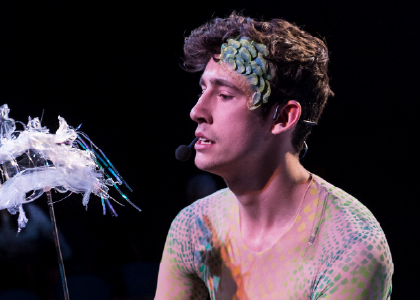 Actor Teo Saefkow interacts with a plastic puppet of a fish. Photo by Donald Lee.