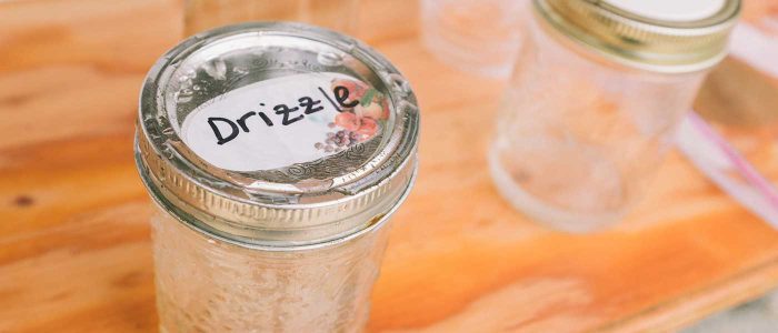 mason jar with drizzle written on the top