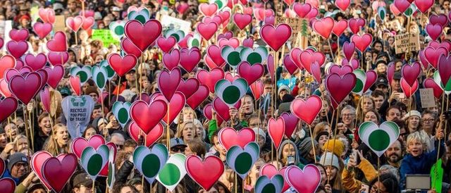 Sea of hearts by The Only Animal, at October 25 climate rally in Vancouver, photo by CBC.
